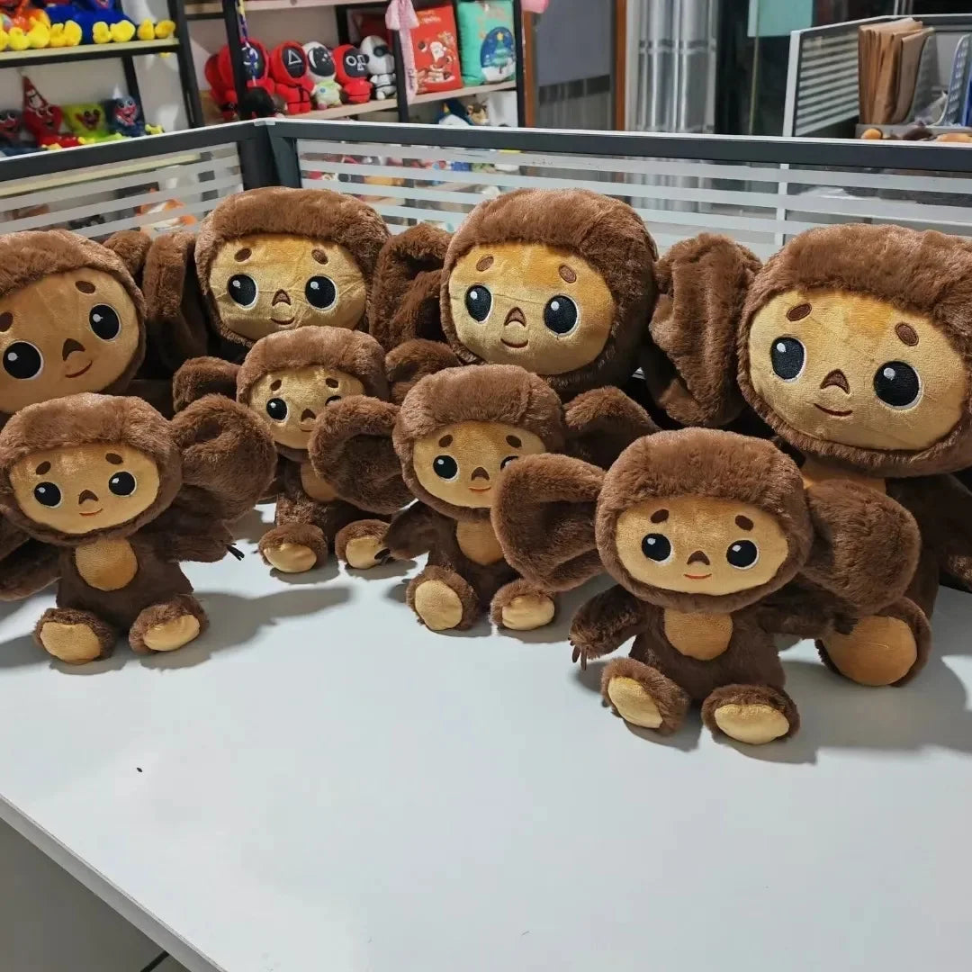 Belle peluche d'anime de singe avec de grands yeux singe