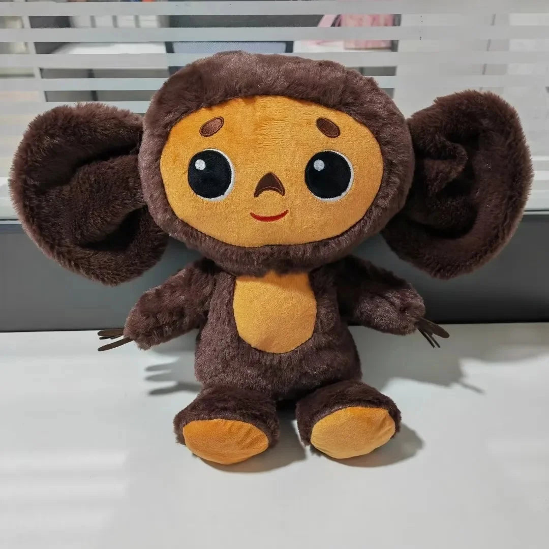 Belle peluche d'anime de singe avec de grands yeux singe